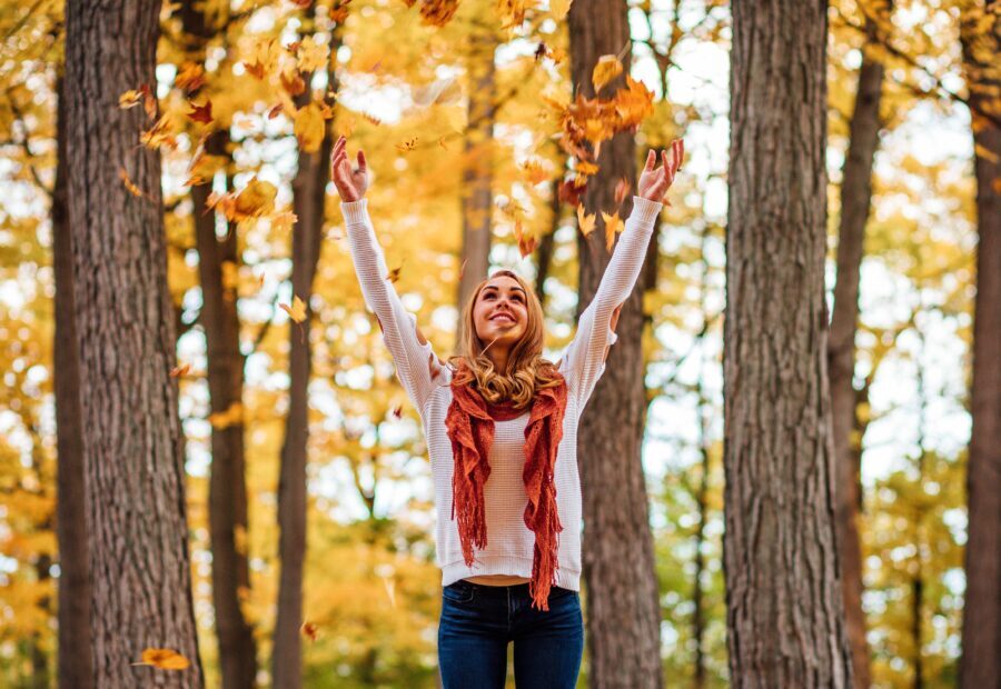 Woman refreshing her soul in the fall foliage